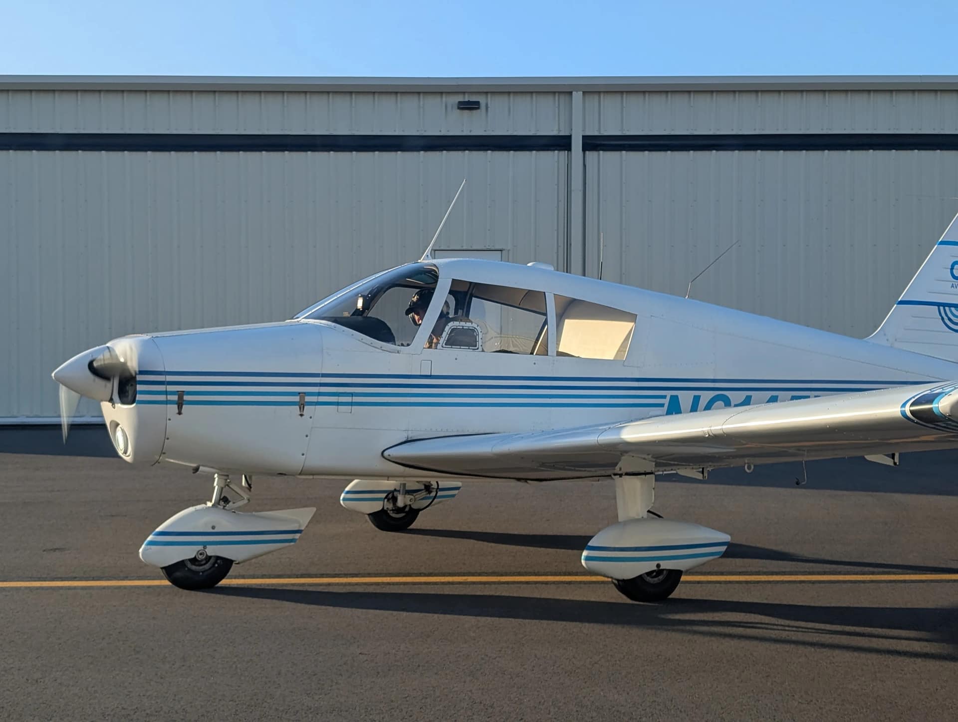 Close view of the Piper Cherokee 140’s classic lines on the ground